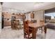 An open dining area features tile floors, a dining table and a view to the back yard at 1902 S Rialto -- # Mesa, Mesa, AZ 85209