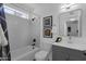 Bright bathroom featuring subway tile surround, modern vanity, framed artwork, and updated fixtures at 19601 N 7Th St # 2095, Phoenix, AZ 85024