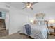 Cozy bedroom featuring a ceiling fan, woven wall decorations and warm, inviting lighting at 19601 N 7Th St # 2095, Phoenix, AZ 85024