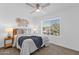 Serene bedroom with a comfortable bed, stylish decor, and a large window with bright light at 19601 N 7Th St # 2095, Phoenix, AZ 85024