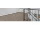 Second floor hallway showing staircase and sleek railing at 19601 N 7Th St # 2095, Phoenix, AZ 85024