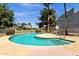 Community pool with chairs and desert landscape in the background at 19601 N 7Th St # 2095, Phoenix, AZ 85024