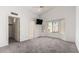 Spacious bedroom with vaulted ceiling, plush carpet and a large window providing natural lighting at 2244 E Rawhide St, Gilbert, AZ 85296