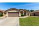 Charming single-Gathering home featuring a well-maintained lawn and a two-car garage at 2244 E Rawhide St, Gilbert, AZ 85296