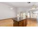 Island kitchen includes a center island, hardwood floors and a breakfast nook with natural light at 2244 E Rawhide St, Gilbert, AZ 85296