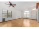 Bright living room features sleek hardwood floors and large windows allowing ample natural light at 2244 E Rawhide St, Gilbert, AZ 85296