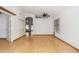 Open living space featuring light hardwood floors, white walls, and a ceiling fan at 2244 E Rawhide St, Gilbert, AZ 85296