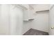 Spacious walk-in closet with built-in shelving and ample storage for clothing and accessories at 2244 E Rawhide St, Gilbert, AZ 85296