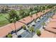 Scenic aerial view of a well-maintained community with lush landscaping and tile roofs at 2311 S Farnsworth Dr # 81, Mesa, AZ 85209
