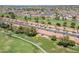 Aerial view shows proximity to golf course and neighborhood amenities at 2311 S Farnsworth Dr # 81, Mesa, AZ 85209