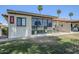 Backyard features patio seating area and views of palm trees at 2311 S Farnsworth Dr # 81, Mesa, AZ 85209
