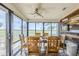 Bright dining area features beautiful natural light, contemporary fan, and a decorative wood accent wall at 2311 S Farnsworth Dr # 81, Mesa, AZ 85209