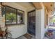 A welcoming front entry with decorative door, and a window featuring bright natural light at 2311 S Farnsworth Dr # 81, Mesa, AZ 85209