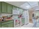 Efficient kitchen with lots of counter space and cabinets under bright lighting and a skylight at 2311 S Farnsworth Dr # 81, Mesa, AZ 85209