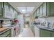 Efficient kitchen with lots of counter space and cabinets under bright lighting and a skylight at 2311 S Farnsworth Dr # 81, Mesa, AZ 85209