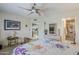 Cozy main bedroom features floral bedding and an ensuite bathroom at 2311 S Farnsworth Dr # 81, Mesa, AZ 85209