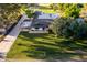 Aerial view of home with a well-manicured lawn and mature trees at 2350 E Melrose St, Gilbert, AZ 85297