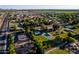 Expansive aerial showing the neighborhood layout, homes, green spaces, and nearby community at 2350 E Melrose St, Gilbert, AZ 85297