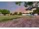 A lush backyard with sprawling lawn and a tennis court, perfect for outdoor activities at 2350 E Melrose St, Gilbert, AZ 85297