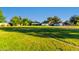 Lush backyard featuring a spacious lawn and mature trees at 2350 E Melrose St, Gilbert, AZ 85297