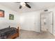 A cozy bedroom with carpet, ceiling fan and unique artwork on the walls at 2350 E Melrose St, Gilbert, AZ 85297