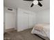 Neutral bedroom with carpet flooring boasts a ceiling fan, closet and bright, natural light at 2350 E Melrose St, Gilbert, AZ 85297