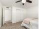 Neutral bedroom with a ceiling fan, plush carpet, closet and ensuite bathroom at 2350 E Melrose St, Gilbert, AZ 85297