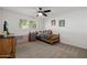 Fun bedroom with neutral carpet, ceiling fan, and bright window light makes for a cheerful space at 2350 E Melrose St, Gilbert, AZ 85297