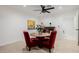 Cozy dining area featuring a round table, red chairs, and a modern light fixture at 2350 E Melrose St, Gilbert, AZ 85297