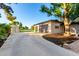 Spacious detached garage with a driveway and access to outdoor tennis court at 2350 E Melrose St, Gilbert, AZ 85297