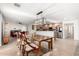 Open floor plan dining area with island and kitchen featuring stainless appliances at 2350 E Melrose St, Gilbert, AZ 85297