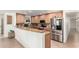 Beautiful kitchen with granite countertops, stainless steel appliances, and breakfast bar at 2350 E Melrose St, Gilbert, AZ 85297
