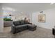 Comfortable living room with open floor plan to dining room and neutral colors at 2350 E Melrose St, Gilbert, AZ 85297
