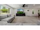 Open living room featuring a big window with modern furnishings and light colored carpet at 2350 E Melrose St, Gilbert, AZ 85297