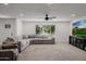 Comfortable living room with grey sectional sofa and big window for natural light at 2350 E Melrose St, Gilbert, AZ 85297