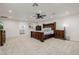 Spacious main bedroom with luxurious dark wood furniture and ceiling fan at 2350 E Melrose St, Gilbert, AZ 85297