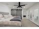 Bright main bedroom includes a barn door closet, ceiling fan, and private access to the backyard at 2350 E Melrose St, Gilbert, AZ 85297