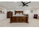 Elegant main bedroom showcasing dark wood furniture and a cozy ambiance at 2350 E Melrose St, Gilbert, AZ 85297
