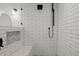 Modern shower featuring subway tile walls, a built-in niche, and a hexagon tile shower floor at 2350 E Melrose St, Gilbert, AZ 85297