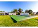 A beautiful tennis court in backyard. The yard has an outdoor kitchen at 2350 E Melrose St, Gilbert, AZ 85297
