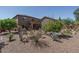 Expansive backyard featuring desert landscaping, rock accents, and a covered patio at 26062 W Potter Dr, Buckeye, AZ 85396