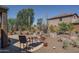 Backyard patio with desert landscaping, rock features, and an inviting seating area at 26062 W Potter Dr, Buckeye, AZ 85396