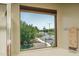 Bright bathroom view of the street showcases natural light and community landscape at 26062 W Potter Dr, Buckeye, AZ 85396