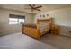 Bedroom with natural light, ceiling fan, and rustic decor at 26062 W Potter Dr, Buckeye, AZ 85396
