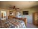 Large bedroom with natural light, ceiling fan, and traditional decor at 26062 W Potter Dr, Buckeye, AZ 85396