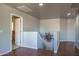 Upstairs hallway with modern railing and unique sunburst decor at 26062 W Potter Dr, Buckeye, AZ 85396