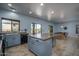 Spacious kitchen with island extending to game room with pool table at 26062 W Potter Dr, Buckeye, AZ 85396