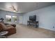 Comfortable living room with tile accents, carpet, and lots of light at 26062 W Potter Dr, Buckeye, AZ 85396