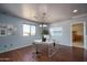 Bright office space with large window, white work station, and modern decor at 26062 W Potter Dr, Buckeye, AZ 85396