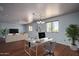 Office and living room combo space with plenty of room and natural light at 26062 W Potter Dr, Buckeye, AZ 85396